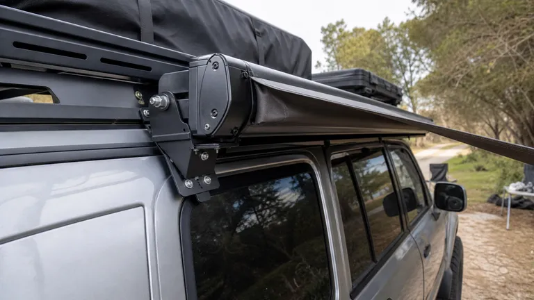 close view of a 270 degree awning mounted along a vehicle side