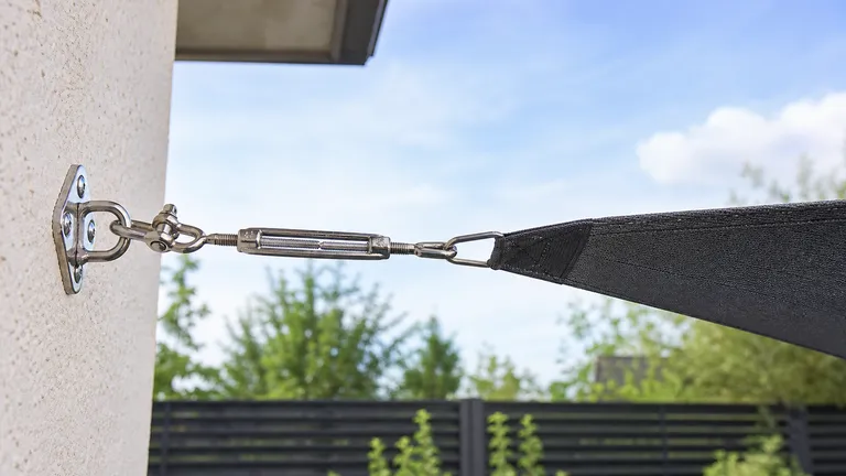 metal turnbuckles used between a shade sail corner and anchor point